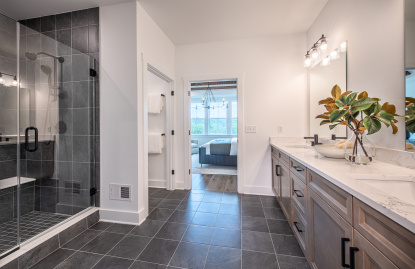 Elegant primary bath with dual vanity.