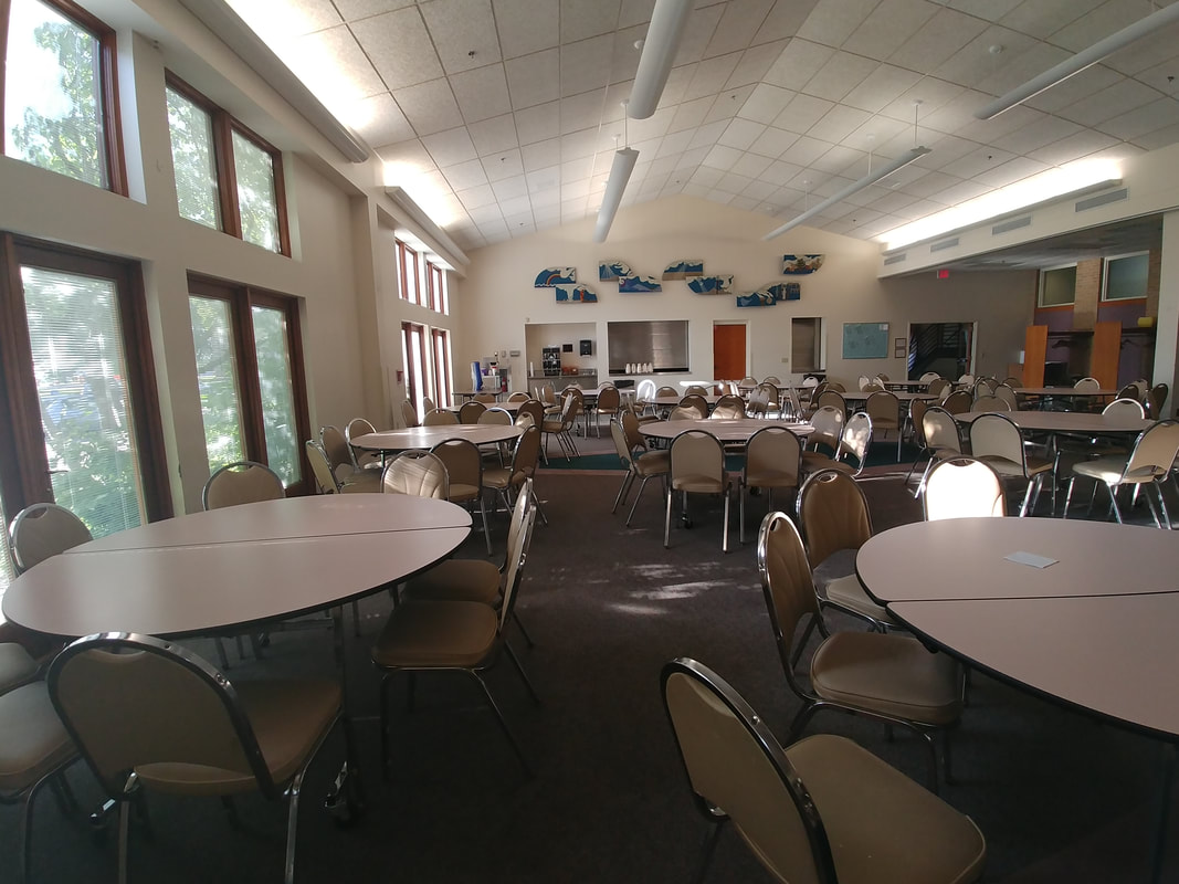 The spacious cafeteria at Progeny Academy provides a welcoming environment where students can enjoy meals, connect with peers, and participate in school activities. Designed to support a positive school culture, this bright gathering space reflects the academy's commitment to fostering a safe, supportive learning community for K-8 students in Brooklyn Center, Minnesota.