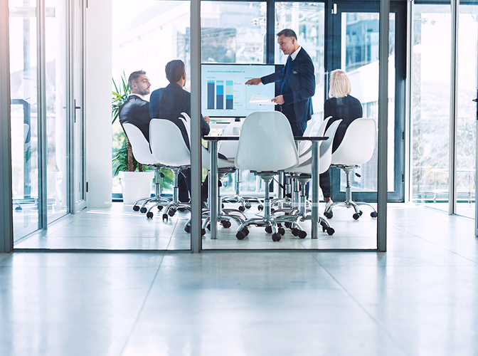 Financial professionals reviewing charts.