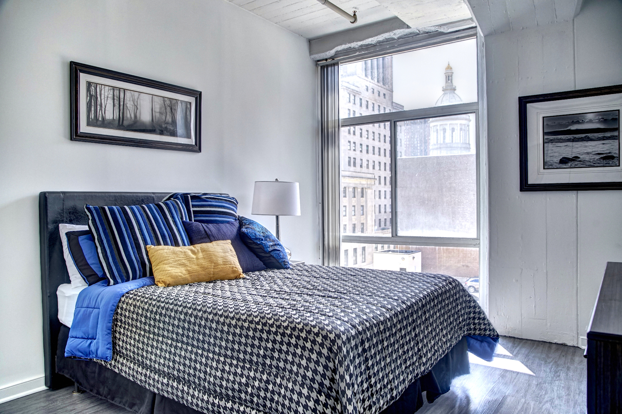 Bedroom with a bed and big windows 