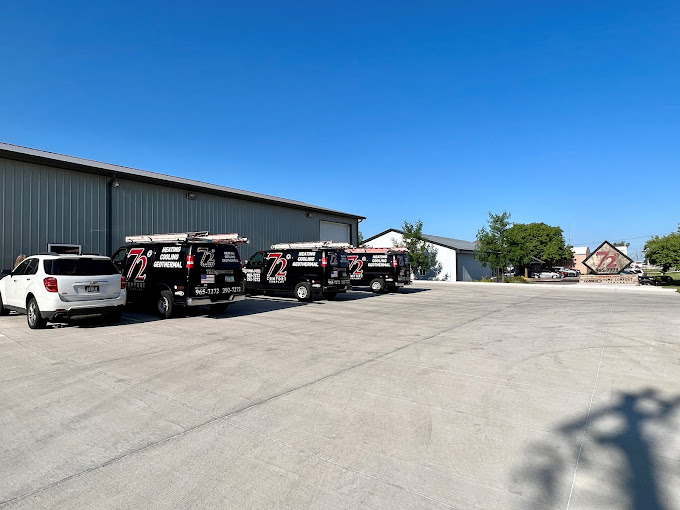 72 Degrees Heating, Cooling, Plumbing & Electrical work vans outside