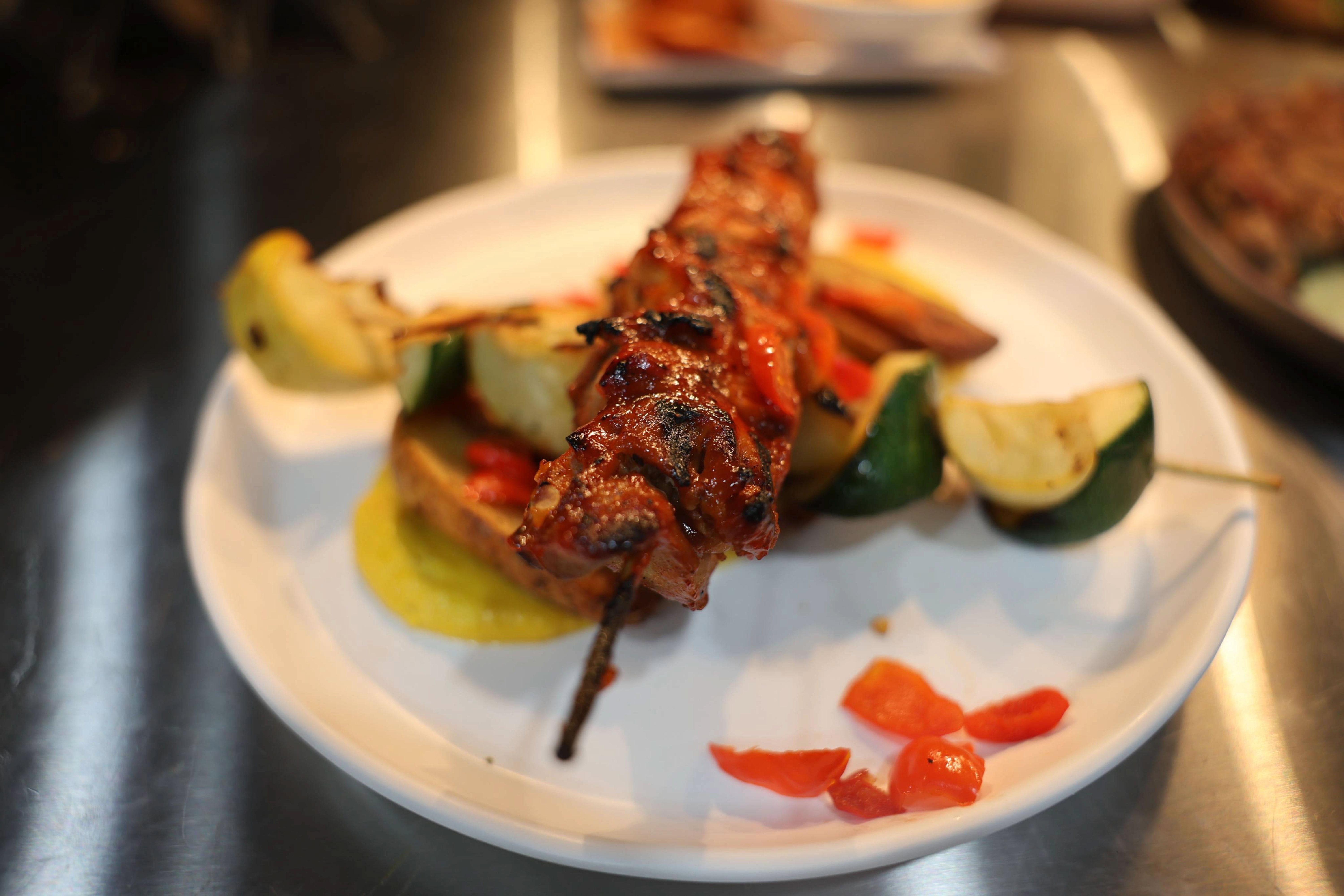 Huancaína sauce, grilled squash, crispy potatoes, chili sauce.