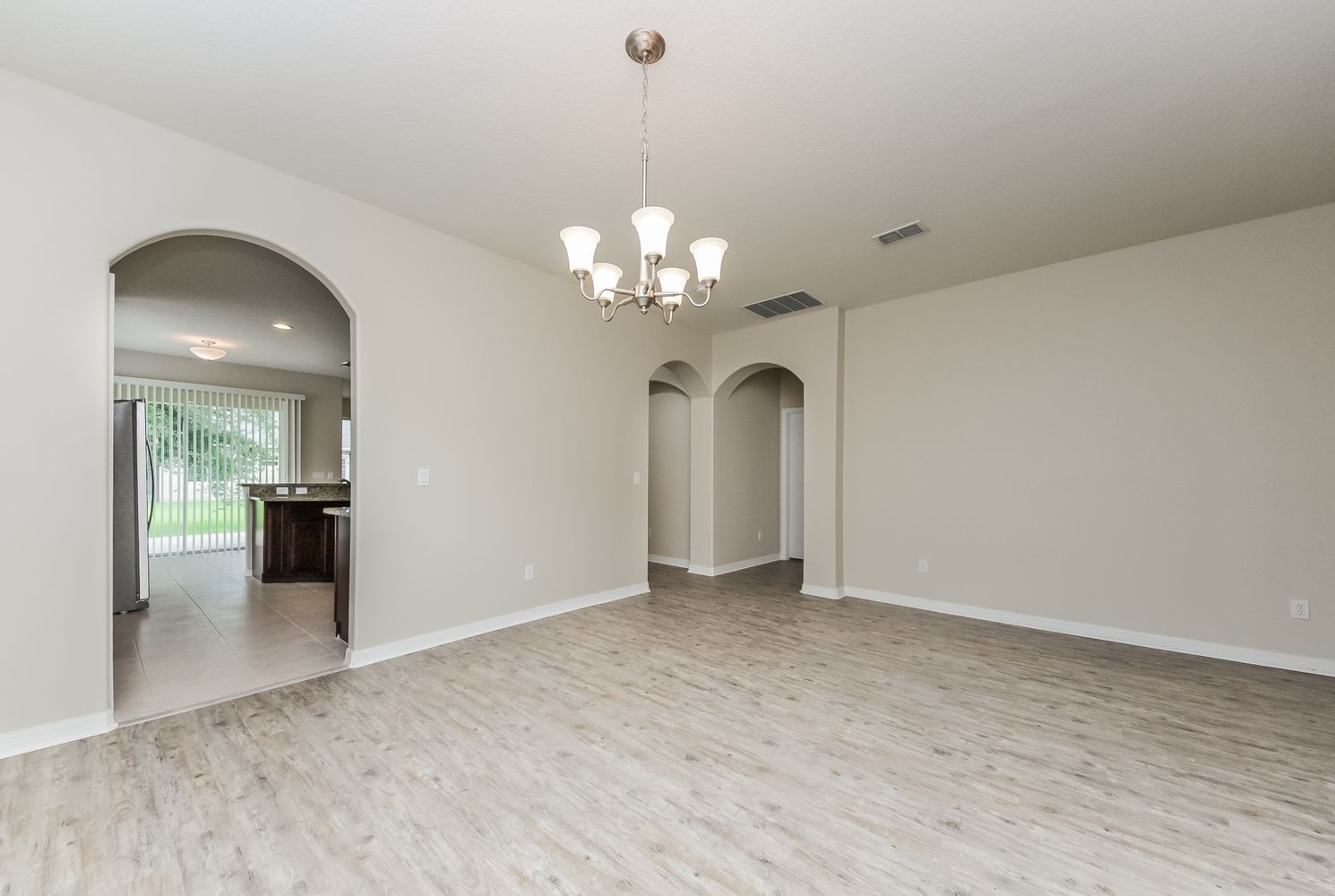 This beautiful home in Orlando, Florida features luxury vinyl plank flooring throughout the living area.