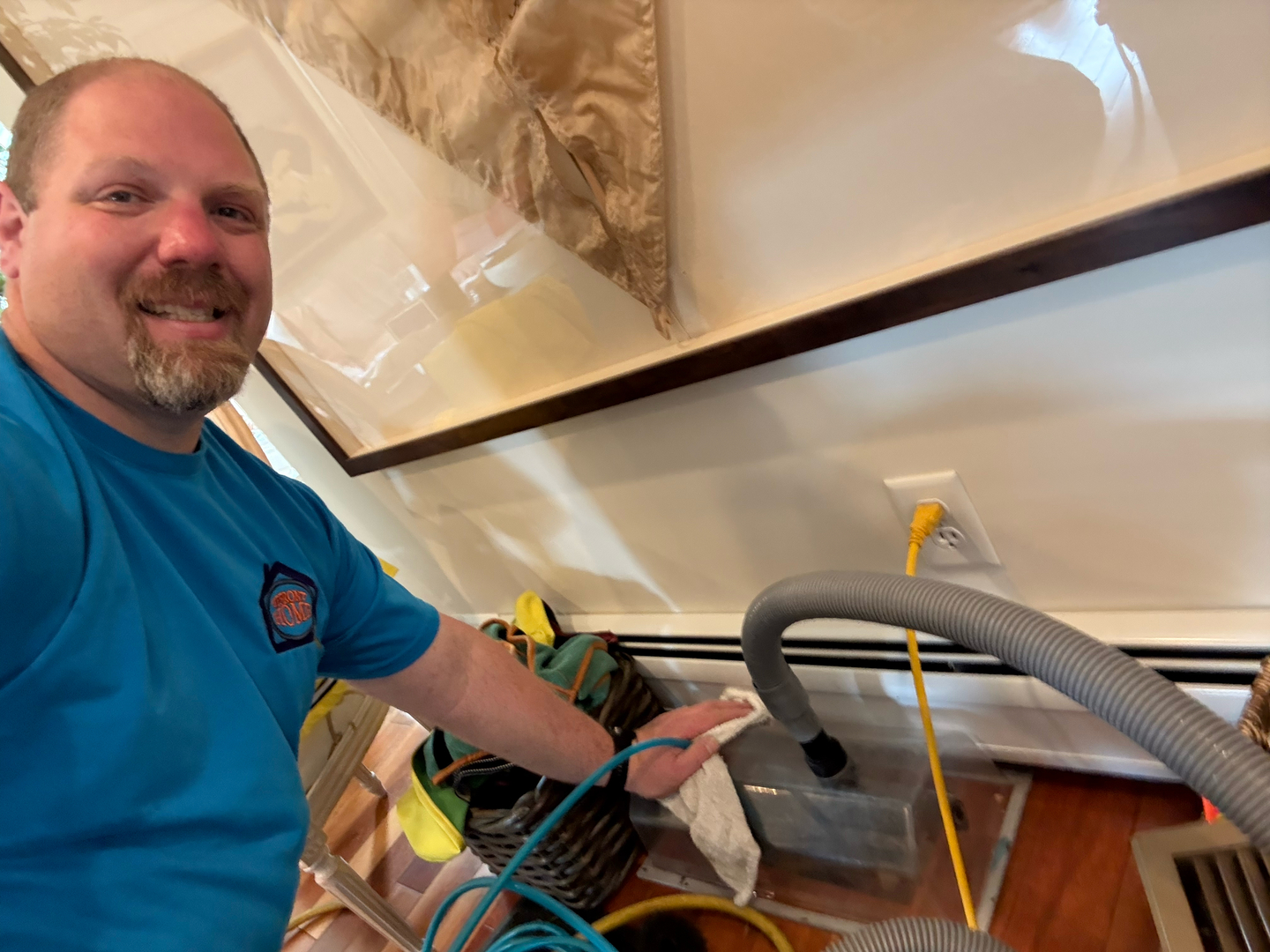 Rick Browning, owner of Upfront Home Inspection & Maintenance, performing residential air duct cleaning using professional equipment. Based in New Gloucester, Maine, Rick provides home inspection, ventilation cleaning, and preventative home maintenance services throughout Southern and Central Maine.