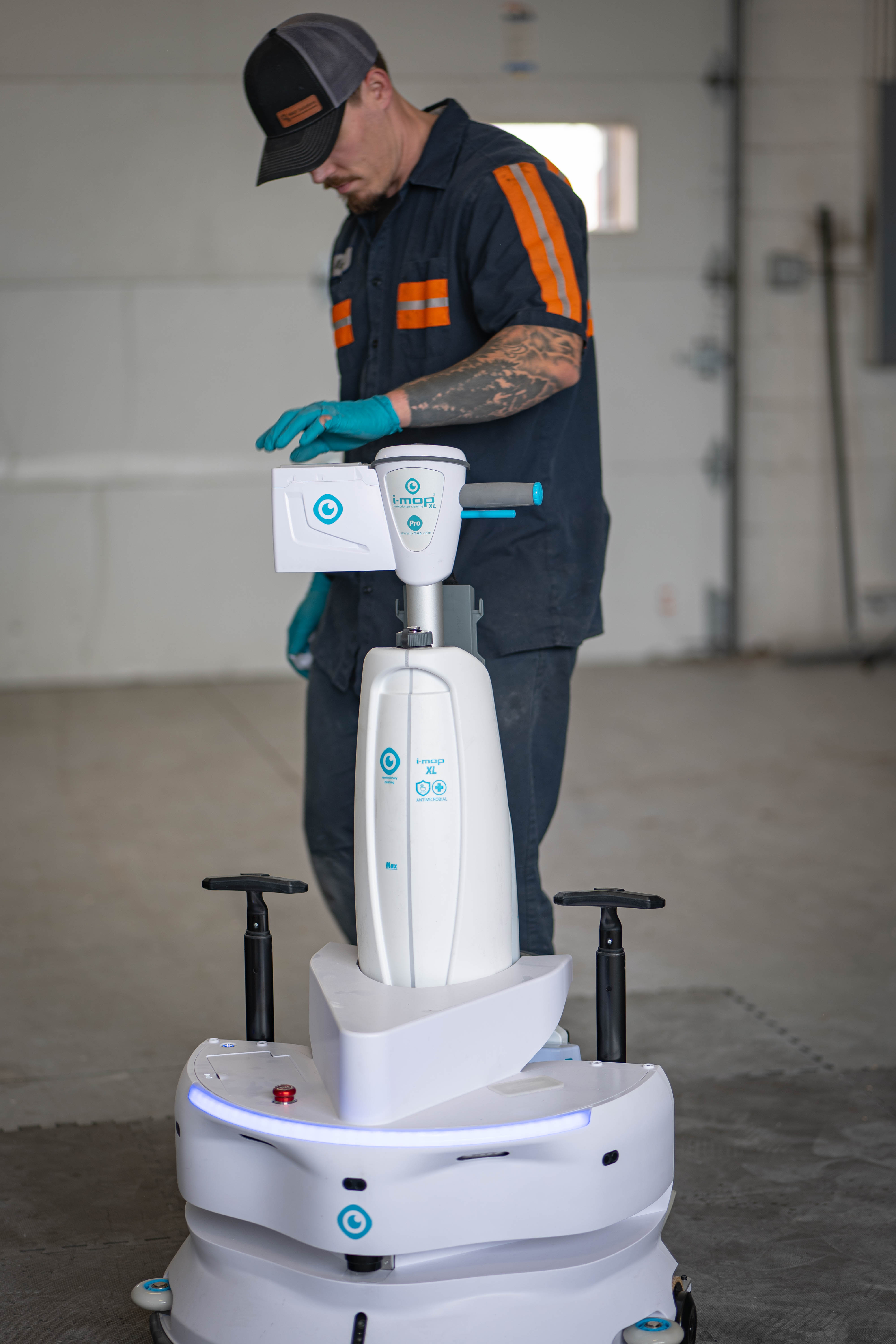A WaySolutions field technician performs a systems check on an advanced i-mop XL commercial floor scrubber docked on an autonomous robotic cleaning base. As supermarket and commercial cleaning fleets evolve to include high-tech robotics, our Layton-based technicians are fully equipped to service, calibrate, and repair the latest automated floor care equipment with precision.