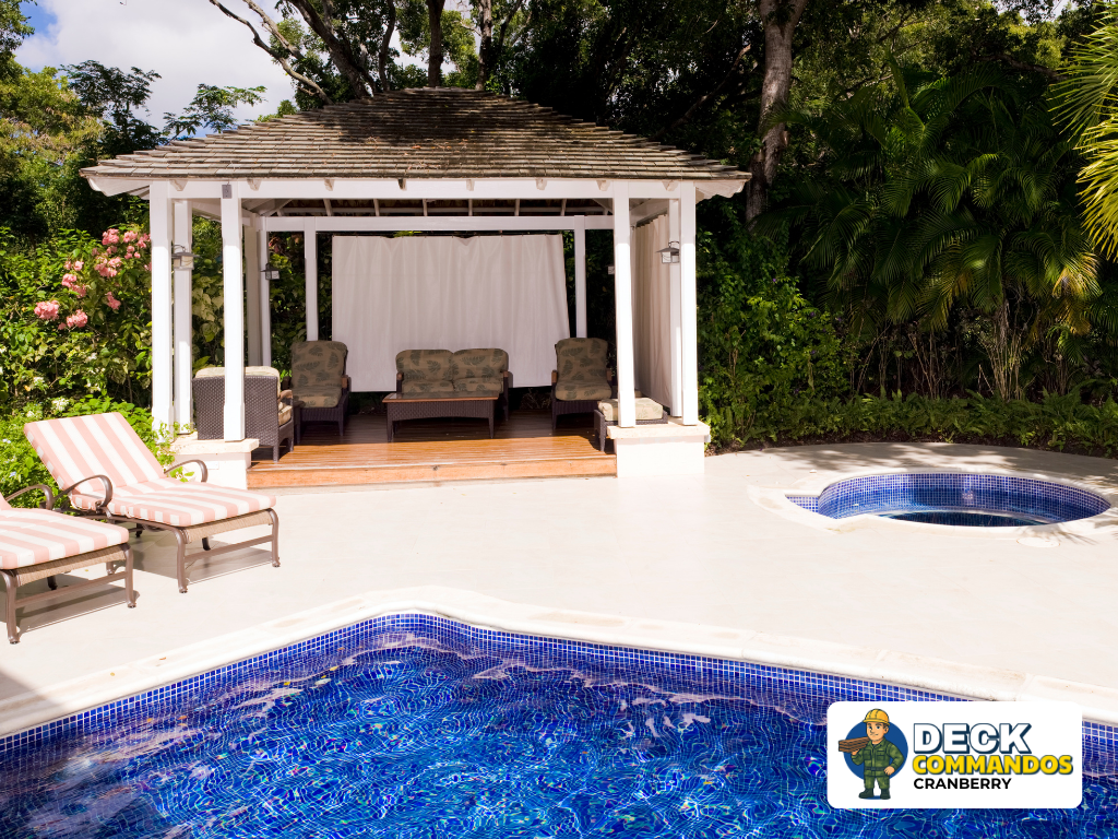 Poolside white gazebo with privacy curtains and resort-style seating area.