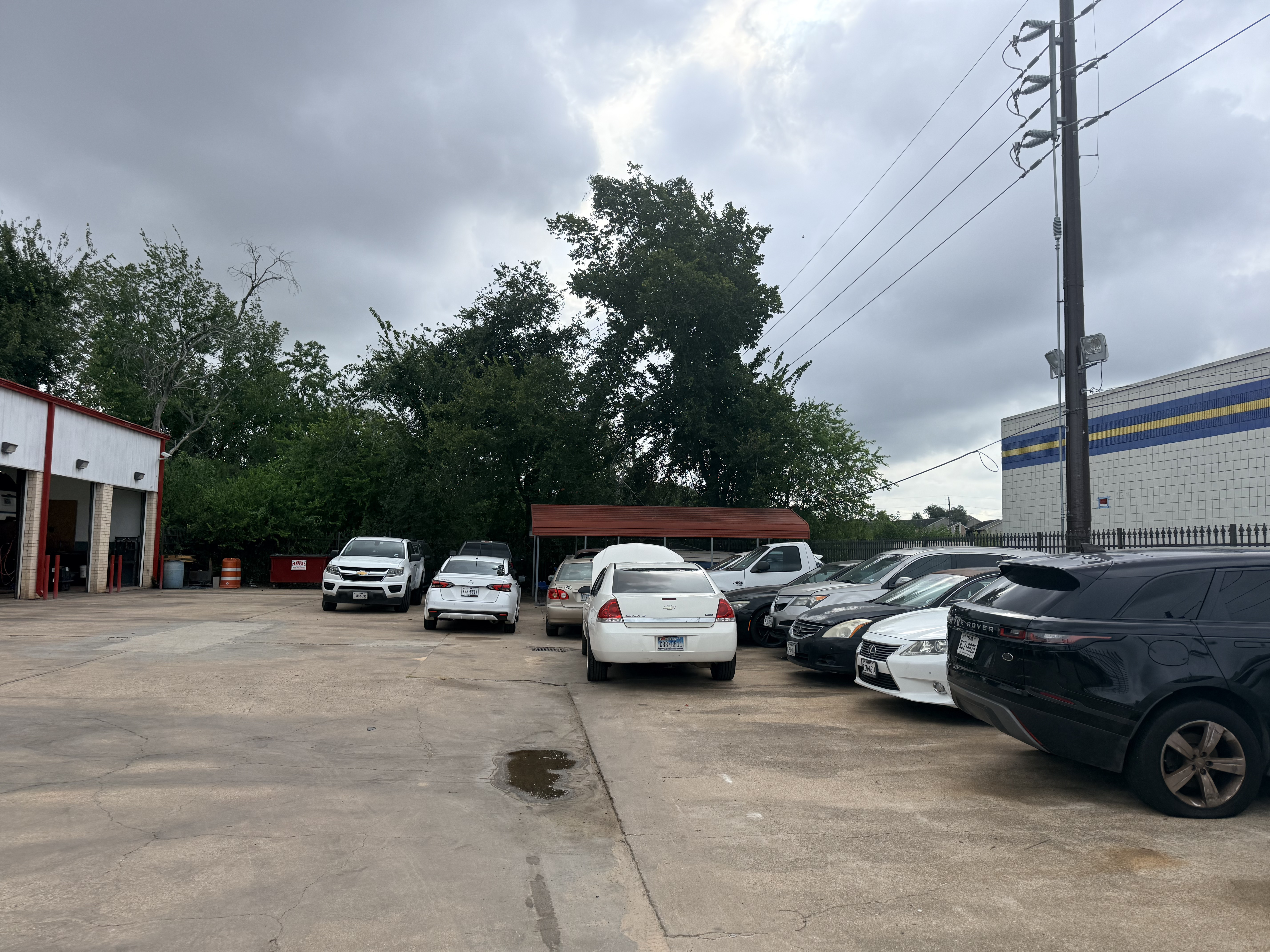 Yes! Automotive, 5608 Highway 6 North, Houston, Texas 77084. Parking lot view that is inside the fenced area