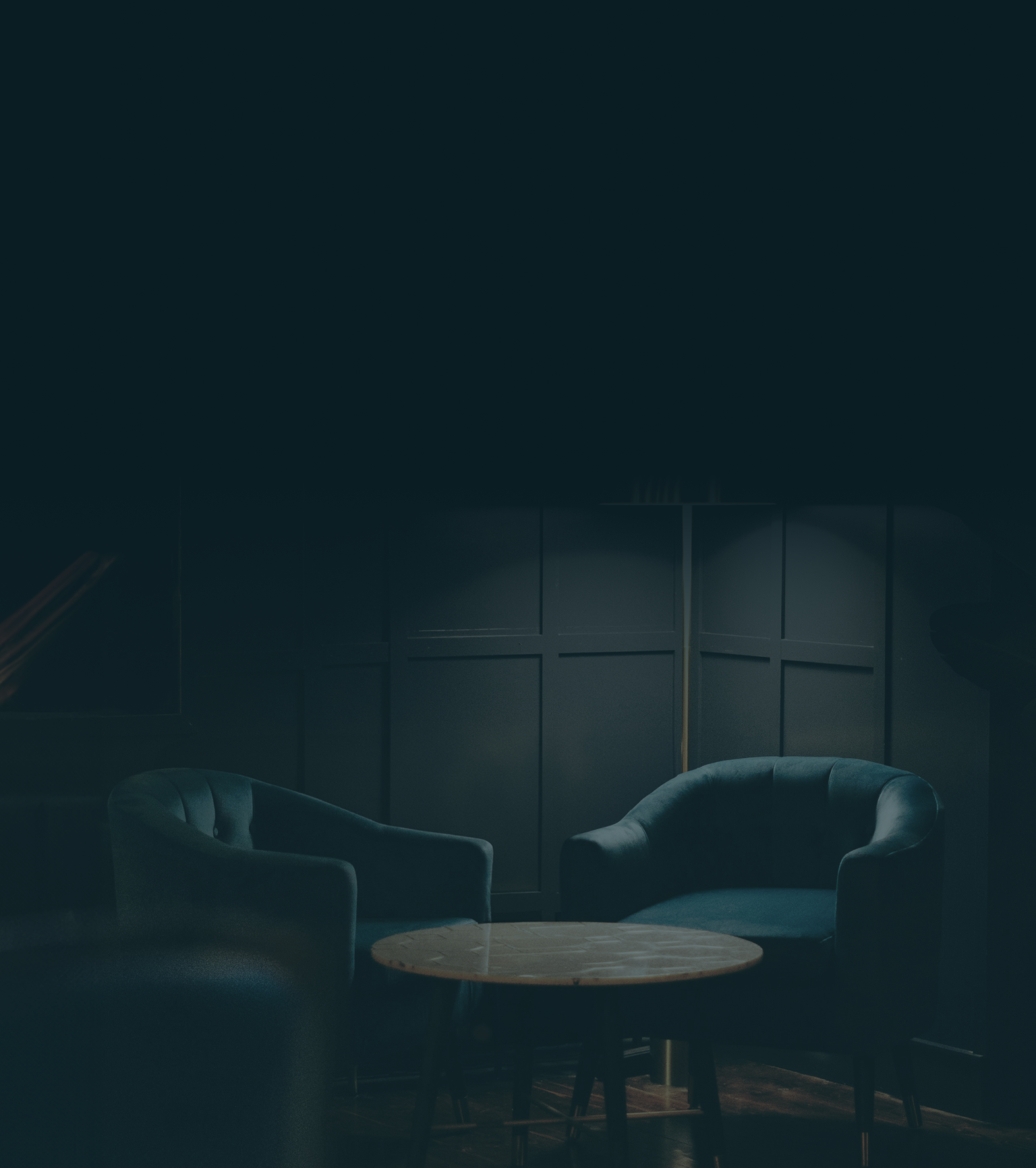 Room corner with chairs and a table.