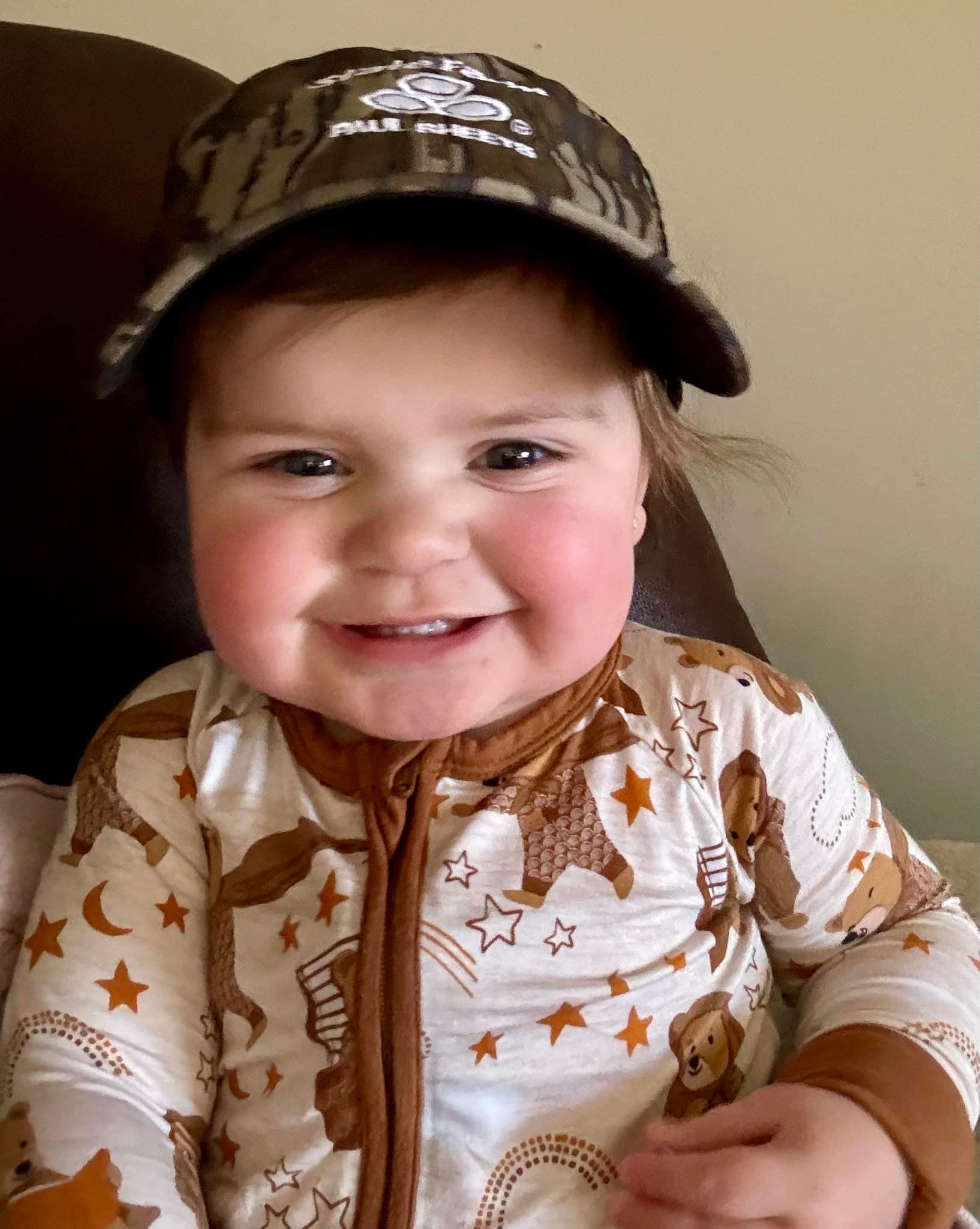 Happy Friday from our hat loving friend, sweet Miss Cora Jayne!  She loves wearing her Paul Sheets camo hat just like her Daddy