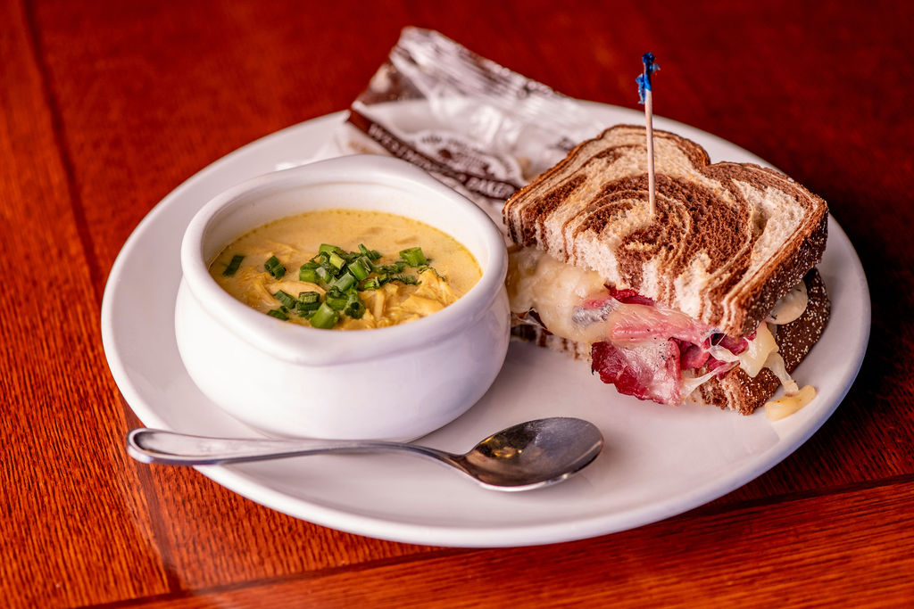 half reuben sandwich & a bowl of chicken curry soup