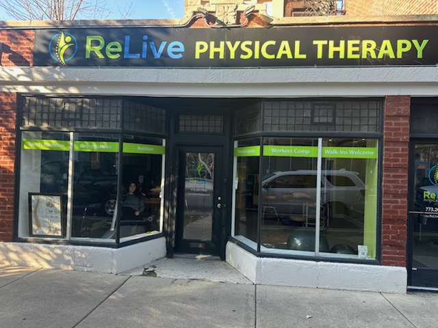 Relive Physical Therapy in Bloomingdale, IL features a welcoming street-front clinic with large windows and clear signage that makes it easy to spot. The exterior showcases the modern ReLive Physical Therapy logo and bold lettering, giving the clinic a professional and approachable look. Through the front windows, you can see an inviting therapy space equipped for rehabilitation, exercise, and patient care. The storefront displays helpful service indicators such as Workers Comp, Walk-Ins Welcome, and Nutrition, highlighting the clinic&rsquo;s commitment to accessible, comprehensive physical therapy services. Conveniently located at street level with easy sidewalk access, Relive Physical Therapy offers a friendly environment designed to support healing and wellness for patients of all ages.