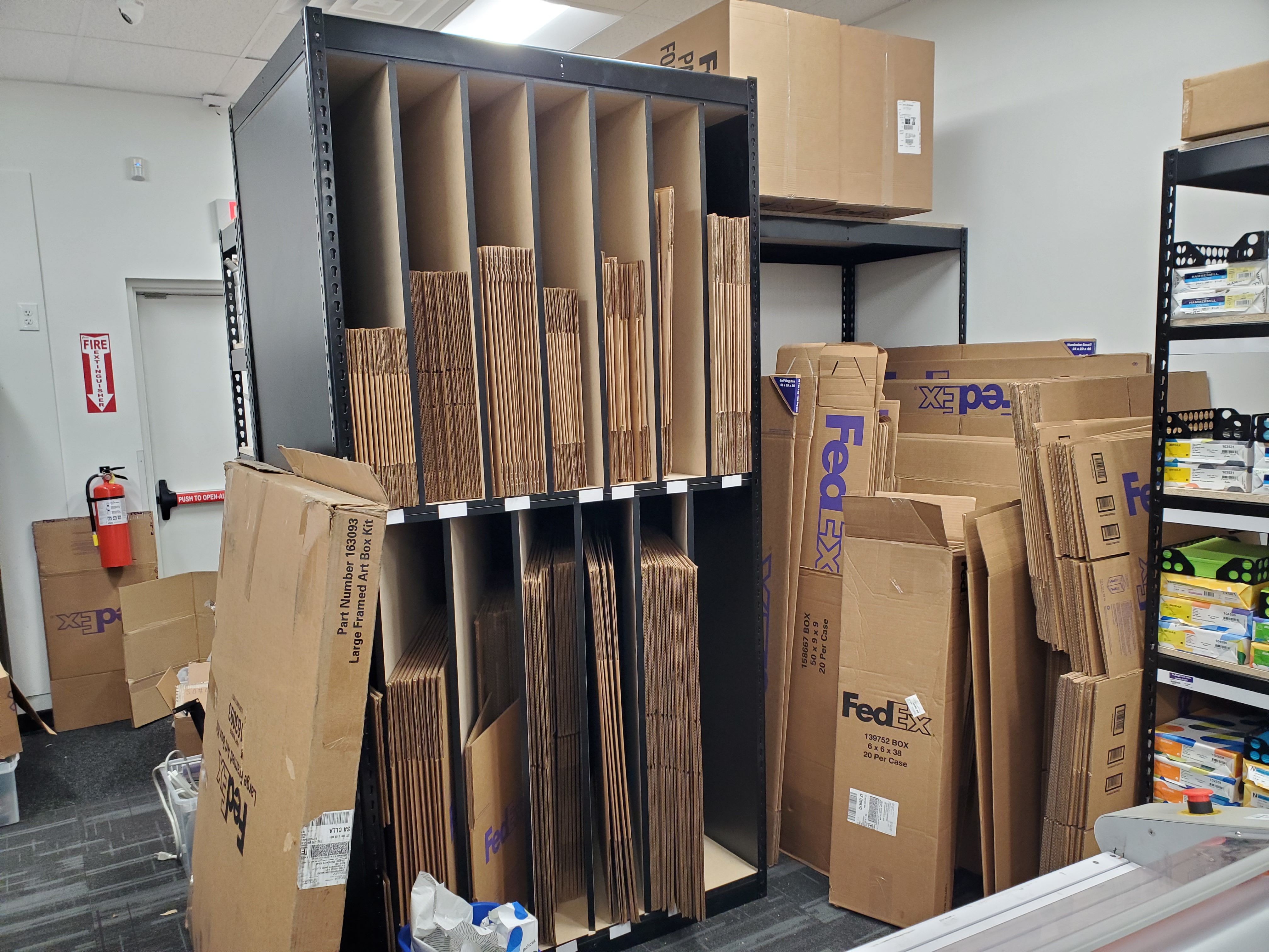 Storage area with FedEx boxes and packaging supplies at FedEx Office College Station Texas used for shipping, packing, and fulfillment services.