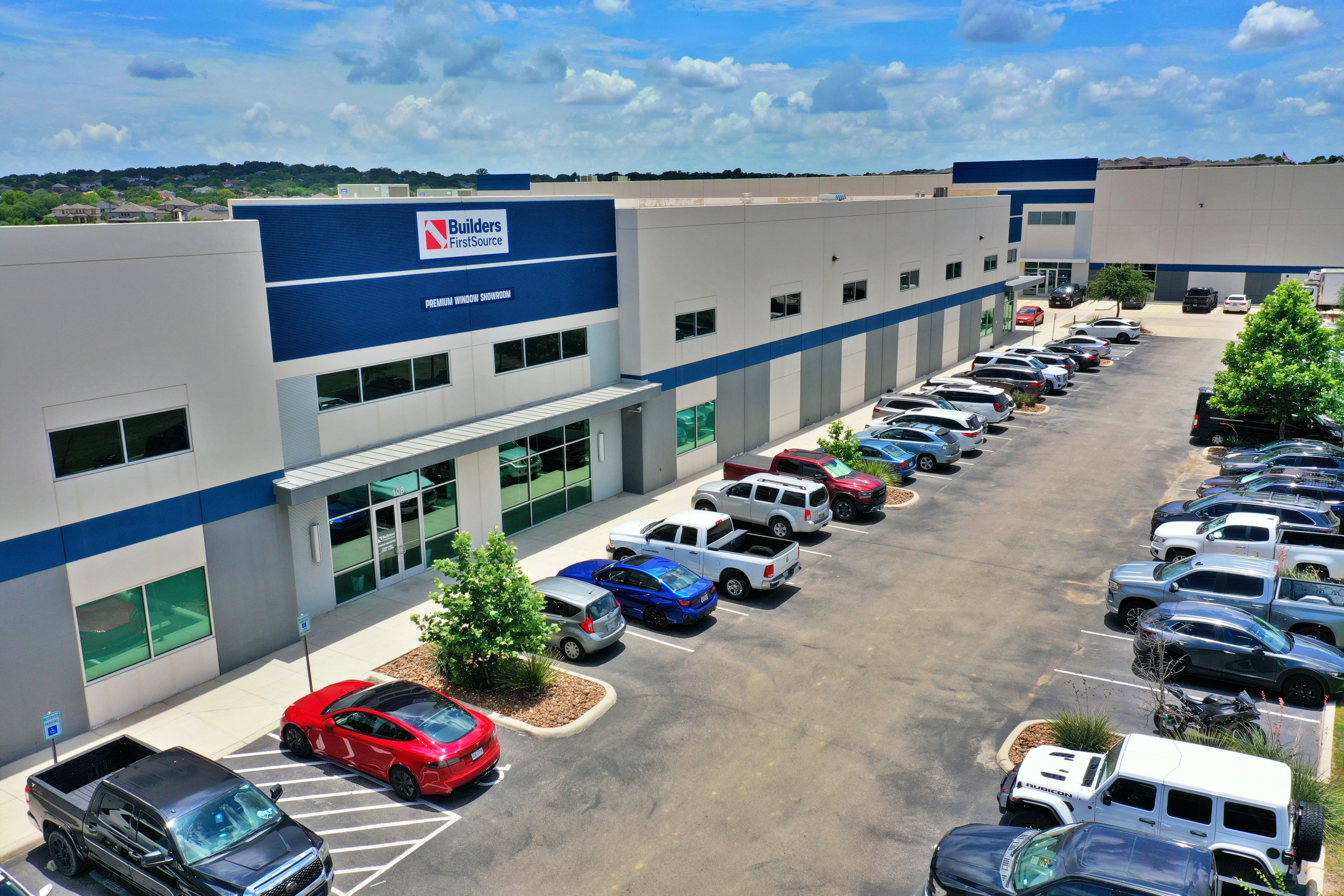 Aerial view of the Builders FirstSource Premium Window Showroom in San Antonio, featuring a modern b 