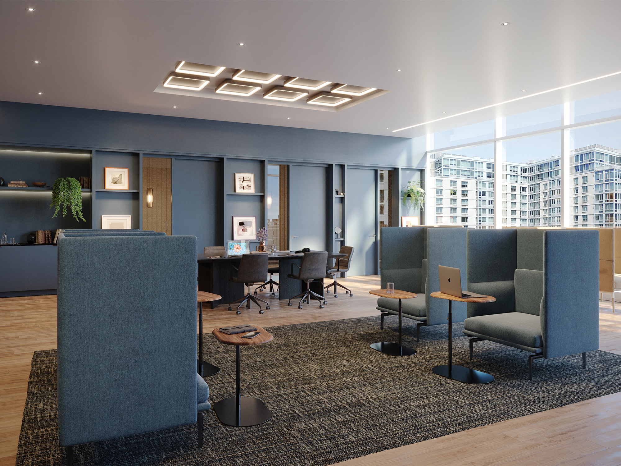 a lounge area with blue chairs and a table in a lobby