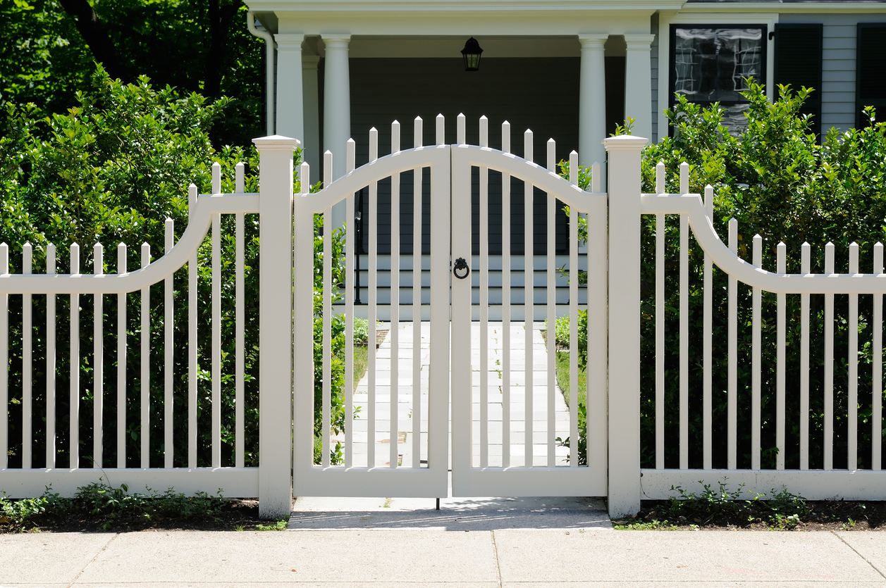 Decorative white fencing and front gate