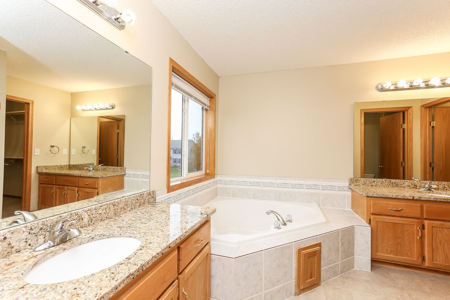 Spacious bathroom with plenty of storage space at Invitation Homes Minneapolis.