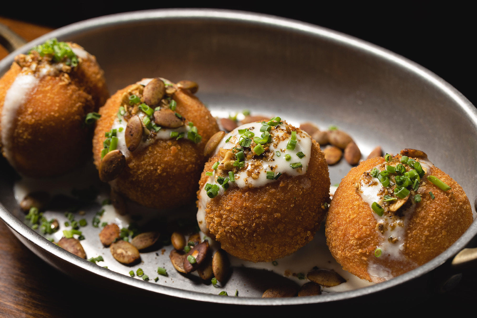 Share Sweet Potato Croquettes with the table at The Independent in Midtown Manhattan