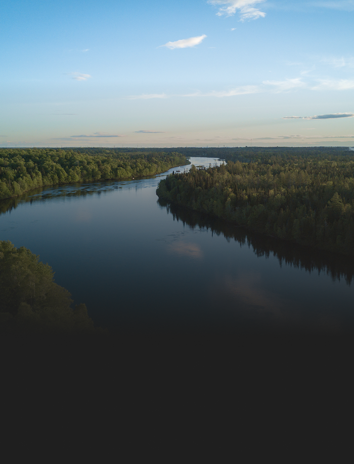 A winding river through a forest.