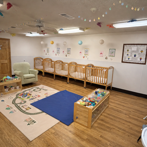 Bright and colorful preschool classroom at Childcare Network with age-appropriate learning materials