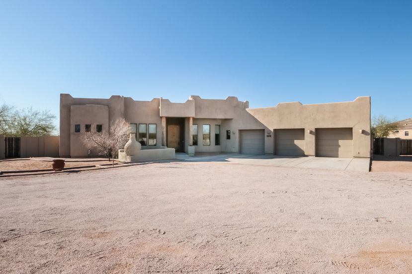 Modern luxury home with a three-car garage at Invitation Homes Phoenix.