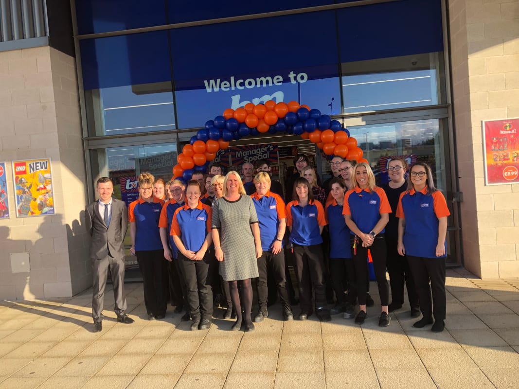 B&M's store team pose outside their brand new store at Fife Central Retail Park, Kirkcaldy.