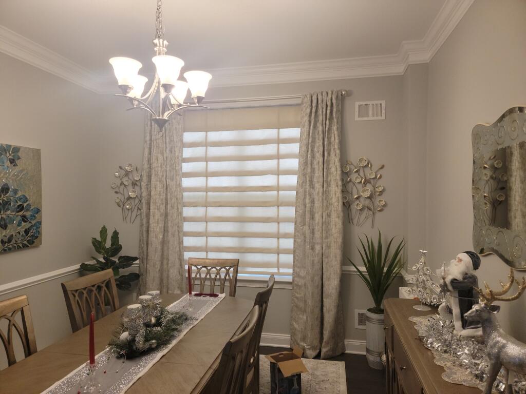 Soft fold Roman shades were the perfect under treatment for this formal dining room in this home in Freehold, NJ