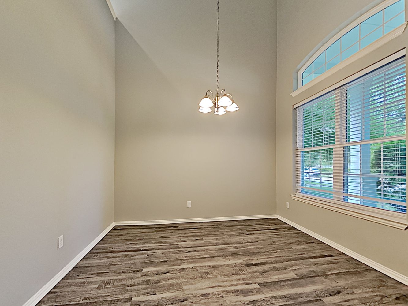 Dining room with luxury vinyl plank flooring Invitation Homes Dallas.