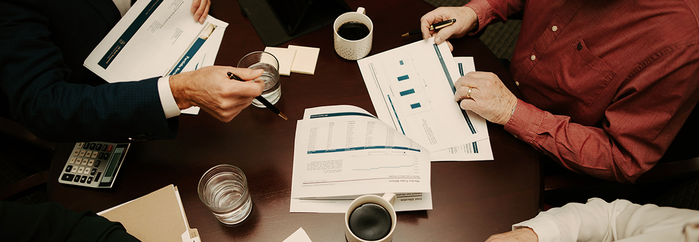 A top-down view wealth professionals collaborating.