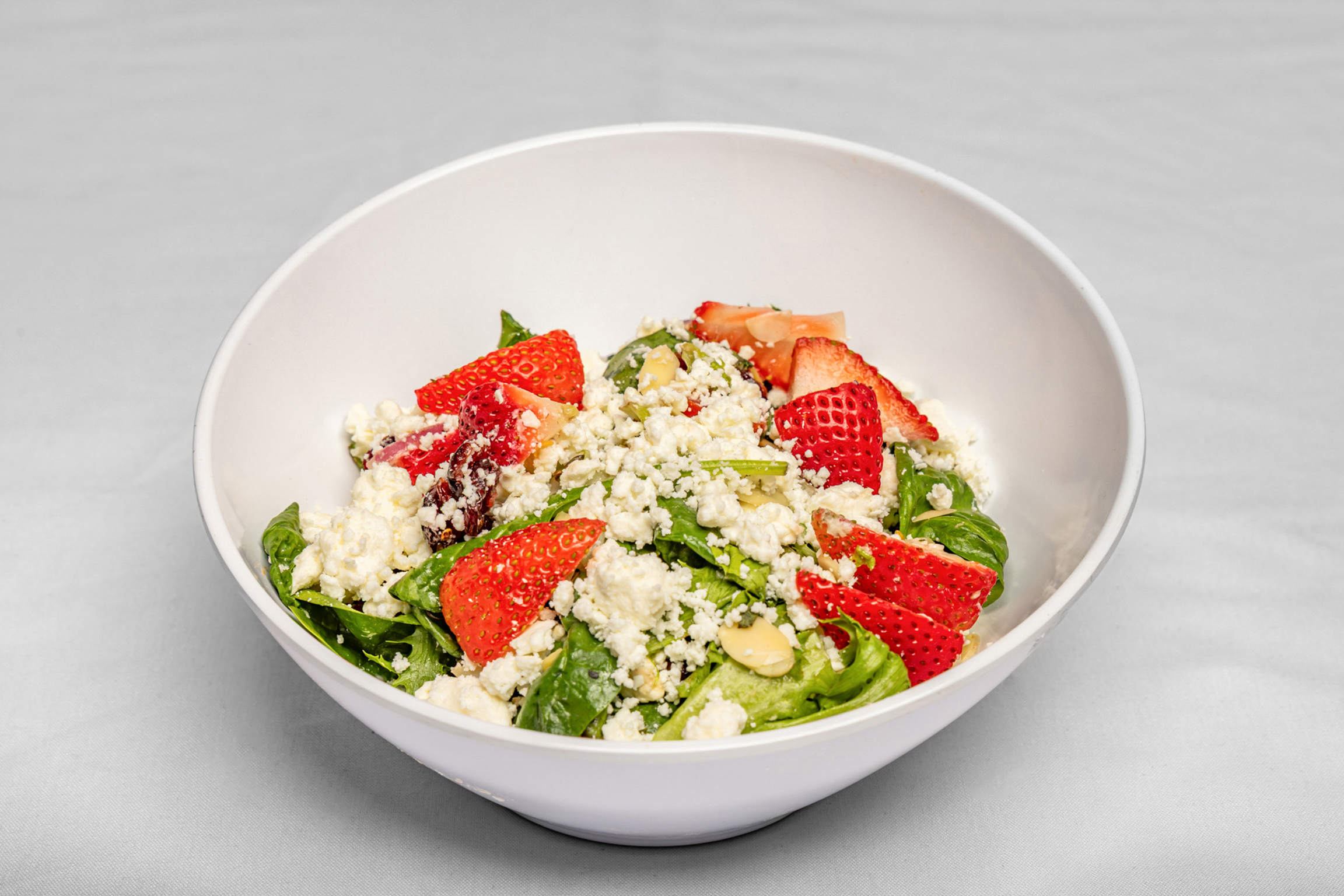 Fresh greens topped with juicy strawberries, light dressing, and a perfect balance of sweet and fresh flavors.
