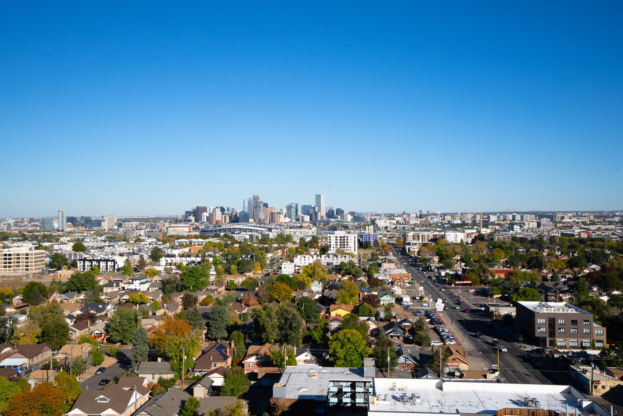 A cityscape with a clear blue sky above.