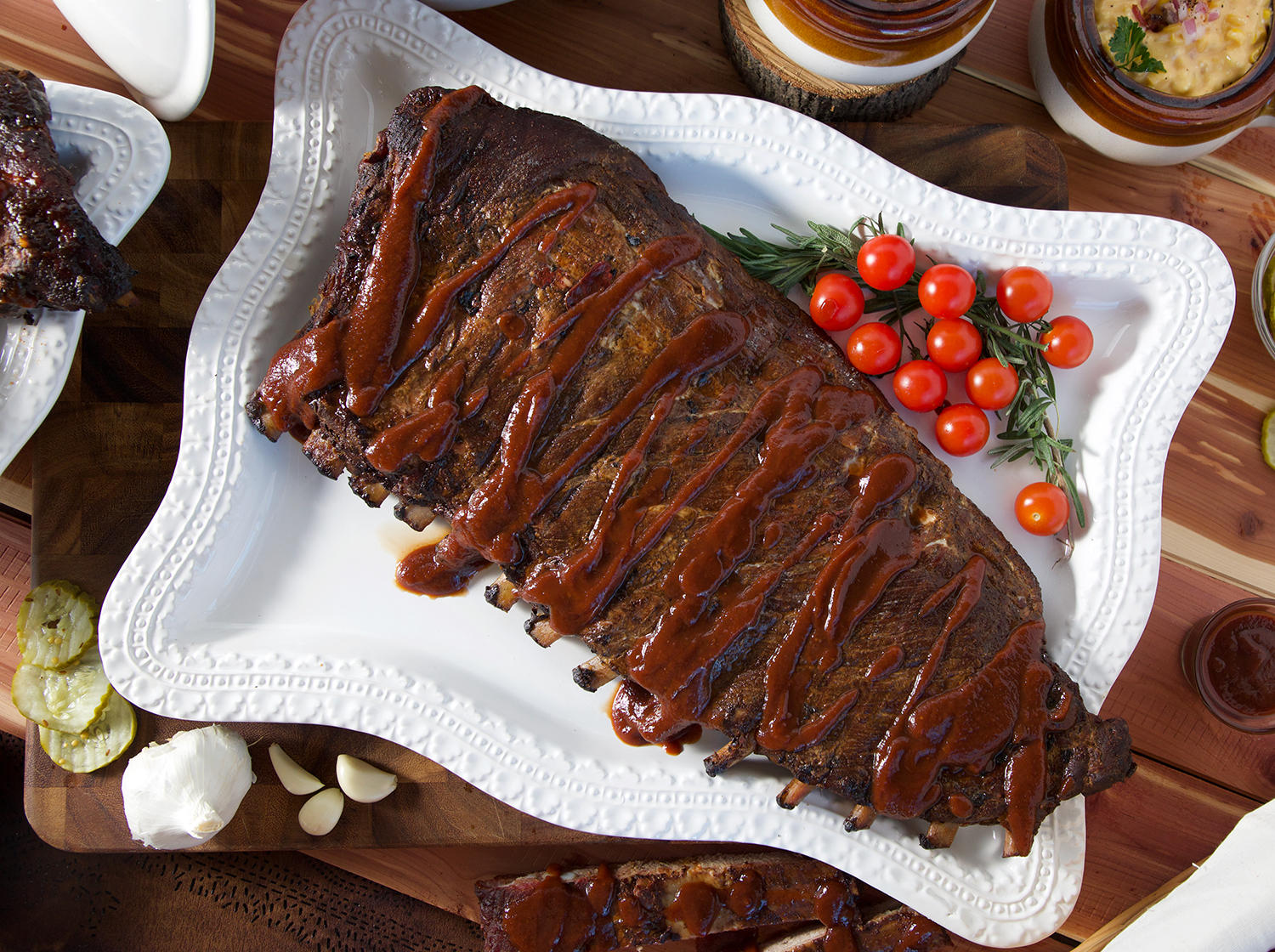 Our delicious Pork Spare Ribs are a Kansas City mainstay. Each tender, meaty slab is expertly rubbed with our own special blend of spices and slow roasted over hickory logs until juicy. They are served with one of our celebrated sauces for a blue-ribbon dining experience.