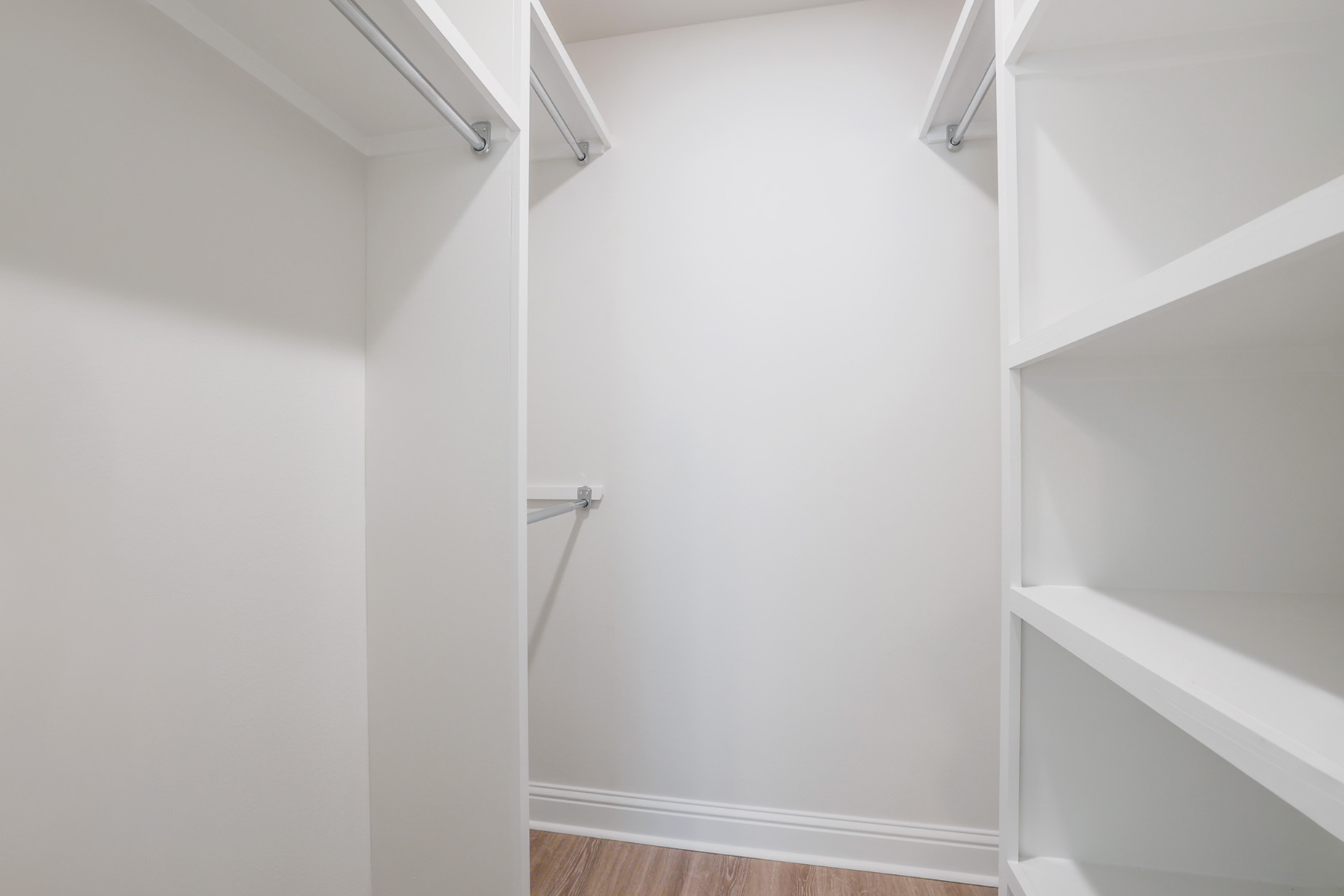 Spacious Closet with Organizational Shelving & Multiple Hanging Options