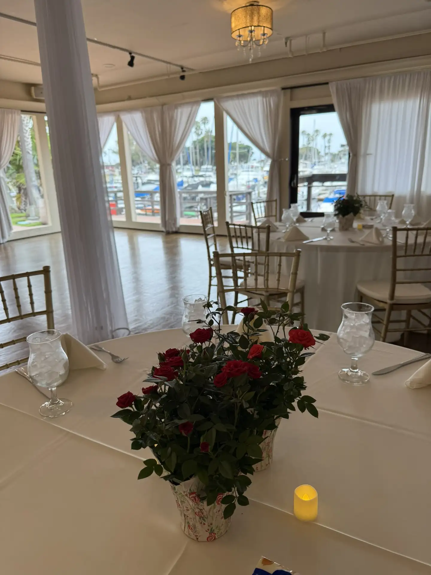 Elegant outdoor memorial event design with lights and drapery