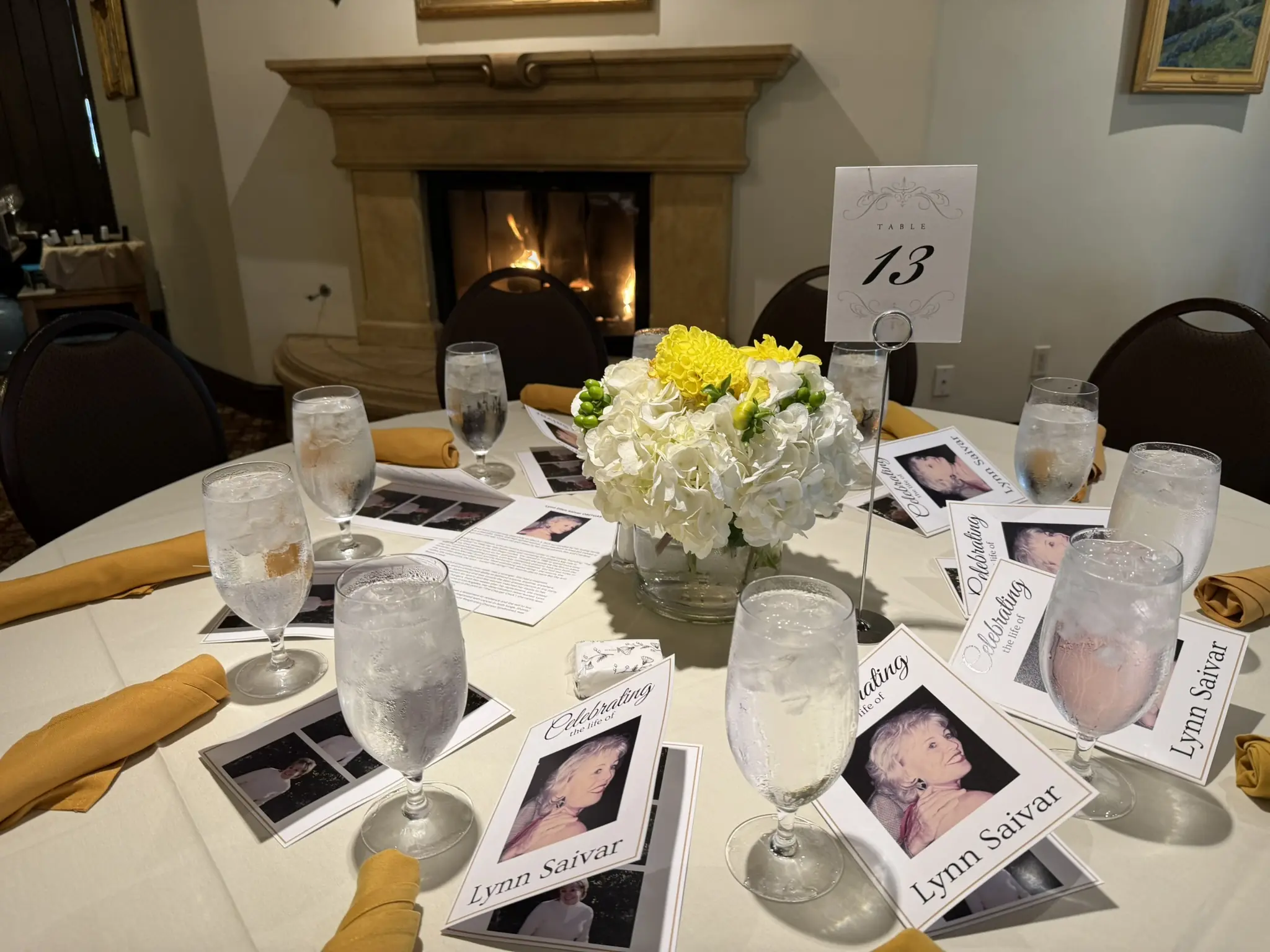 Guests greeting each other warmly at the entrance of a life-celebration event