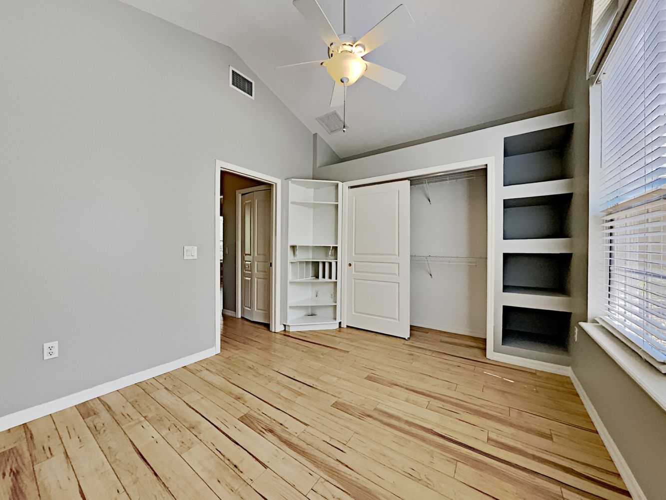 Spacious bedroom with upgraded flooring at Invitation Homes Orlando.