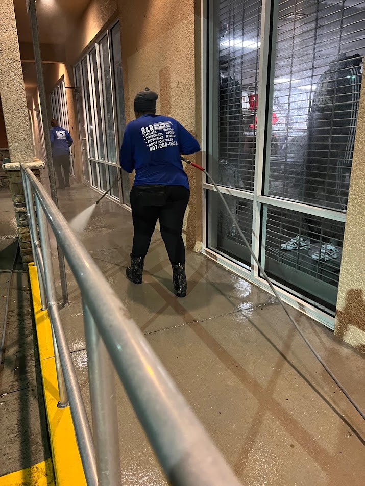 Professional storefront pressure washing in Davenport, FL, removing dirt, algae, mildew, stains, and buildup from commercial exterior surfaces.
