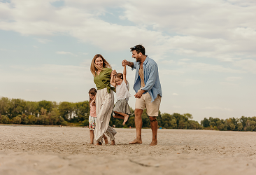 A family walking on the beach.