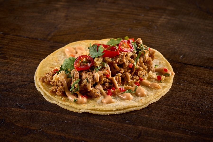 Arbol Spiced Chicken Chorizo, chipotle aioli, chili lime chicken chicharron, cilantro, candied fresno chiles