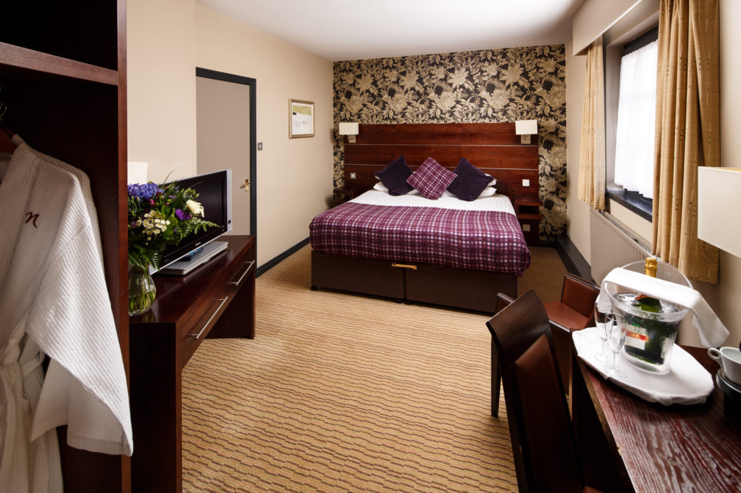 Privilege bedroom at the Mercure Perth Hotel, flowers, dressing gown, champagne. Mercure Perth Hotel Perth 01738 481607