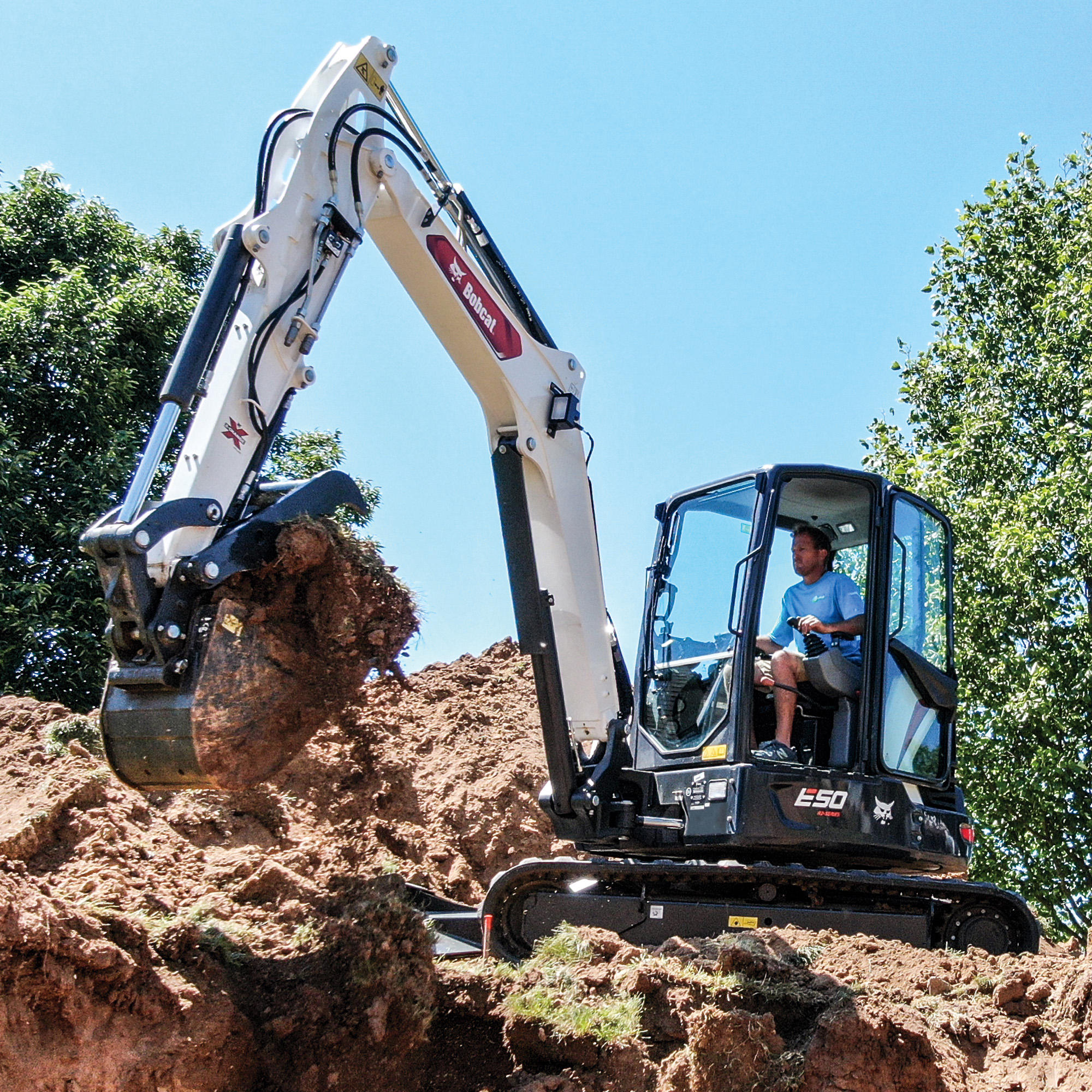 Bobcat E50 digging a trench Paul Equipment Fredericton (506)449-3289