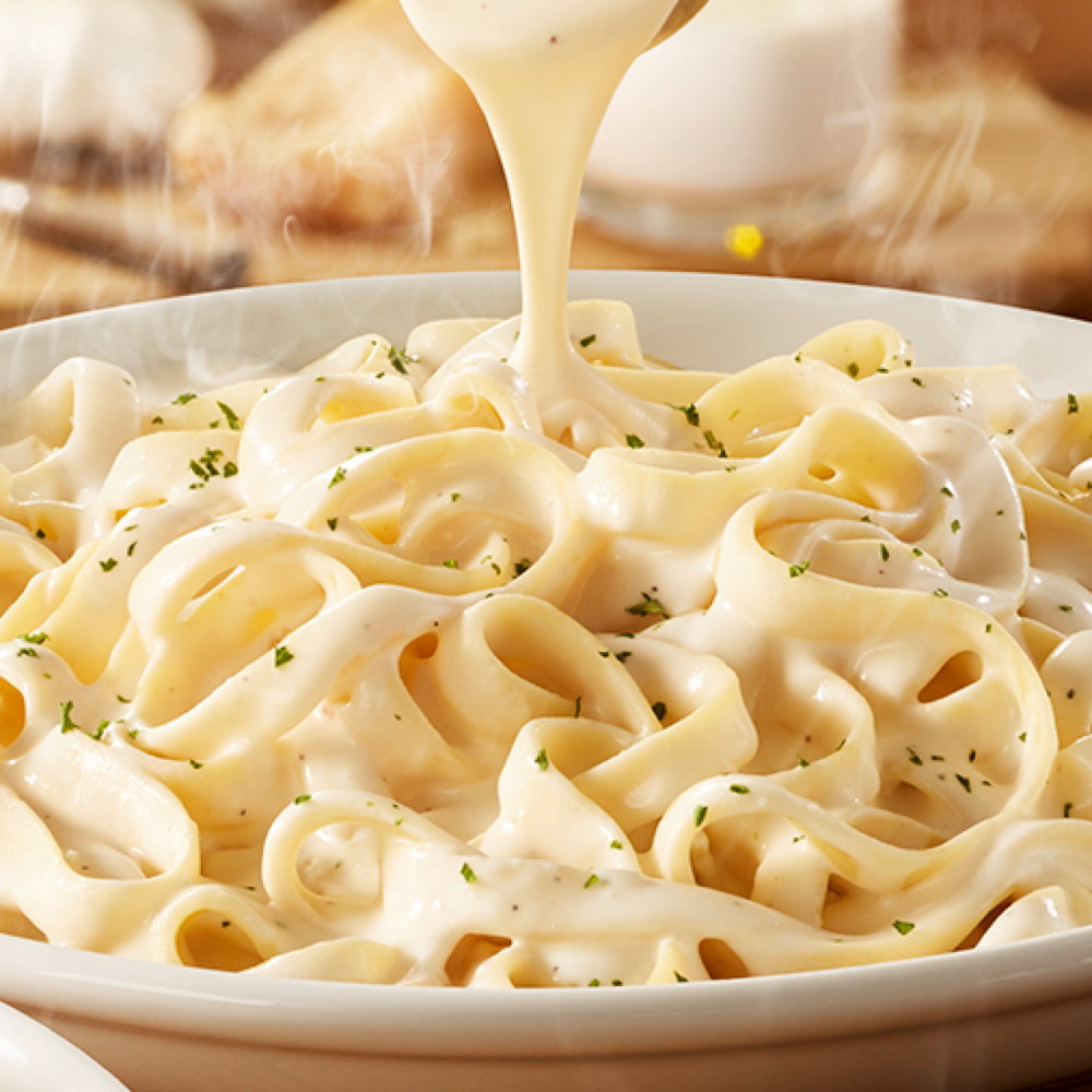Our rich and creamy homemade Alfredo sauce is made with parmesan cheese, butter, heavy cream, and garlic. Served with fettuccine pasta.