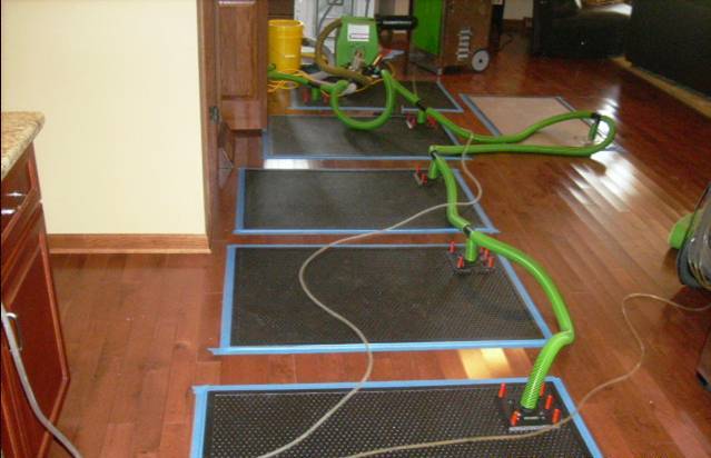 The floormat system is in place to save the flooring after a water loss.