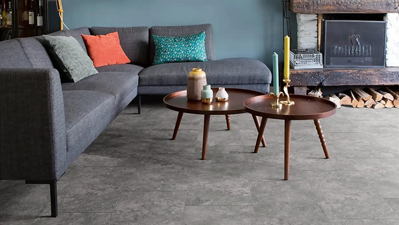 A dark grey Luxury vinyl flooring in a modern dark grey living room
