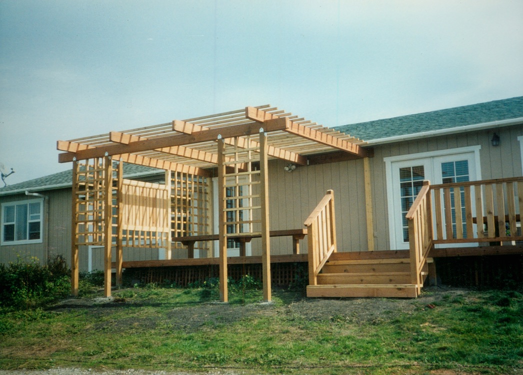 Large backyard pergola and wood structure designed to enhance outdoor living and entertaining spaces.