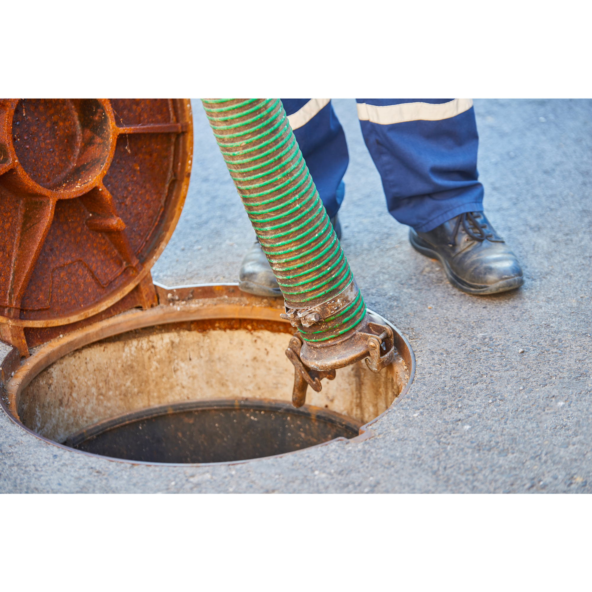 "Cleaning the depths: Brave workers tackle the grimy task of sewer cleaning, ensuring a hygienic and functional underground network for the community's well-being."
