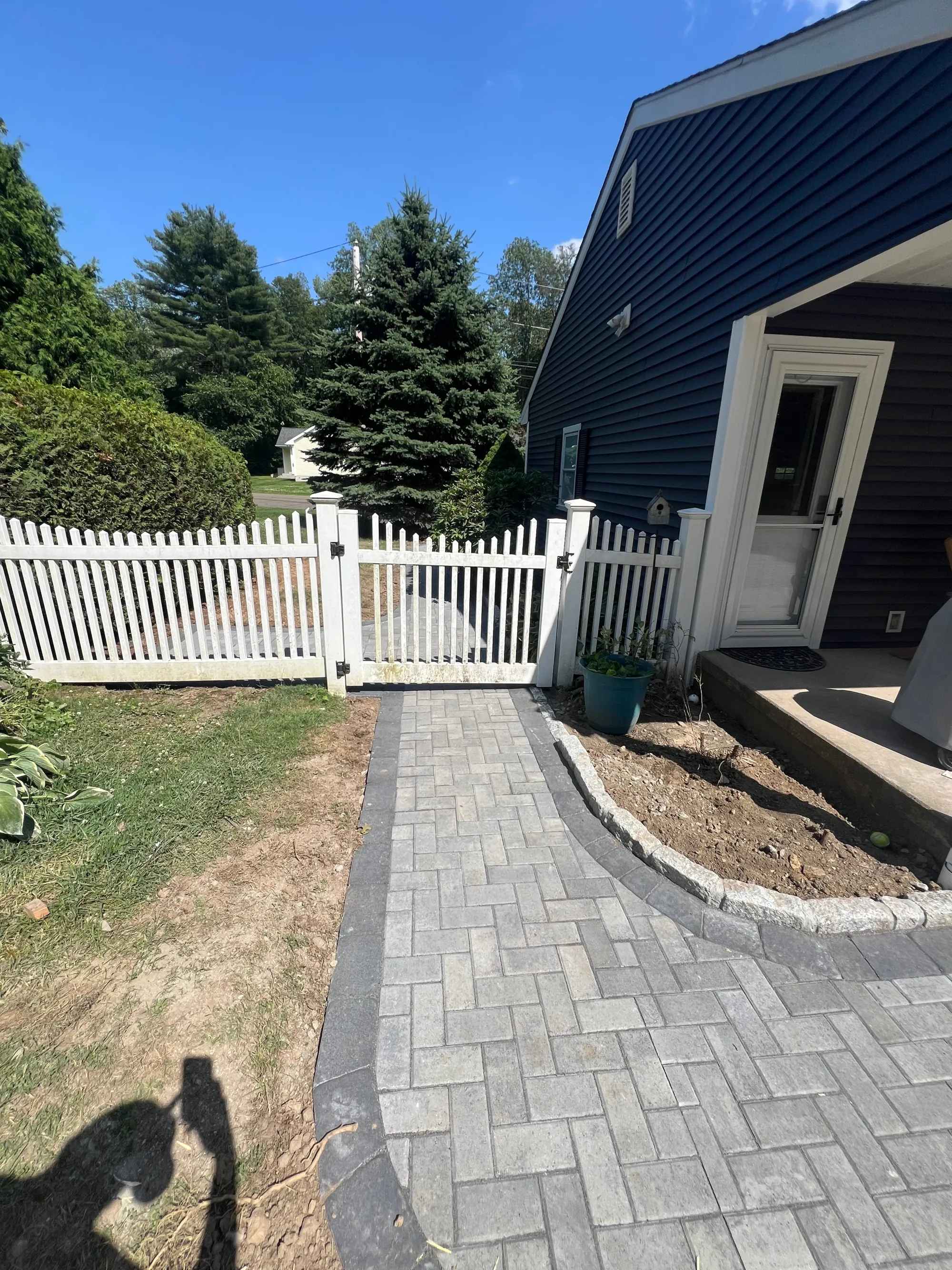Walkway leading to backyard patio - Walkways and pathways project by General Masonry LLC.