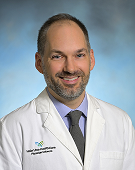 Headshot of Elijah Riddle, MD, FACS
