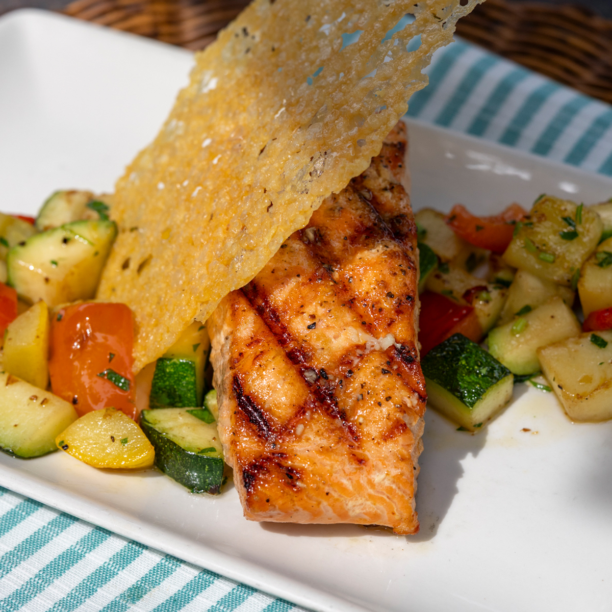 Lemon Garlic Salmon | squash & zucchini medley, garlic butter, crispy parmesan