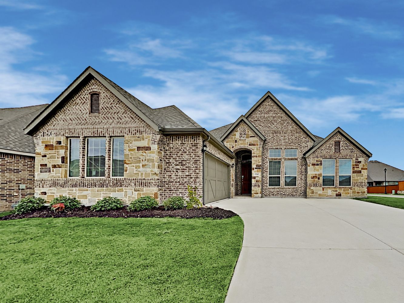 Beautiful home with two-car garage and covered porch at Invitation Homes Dallas.