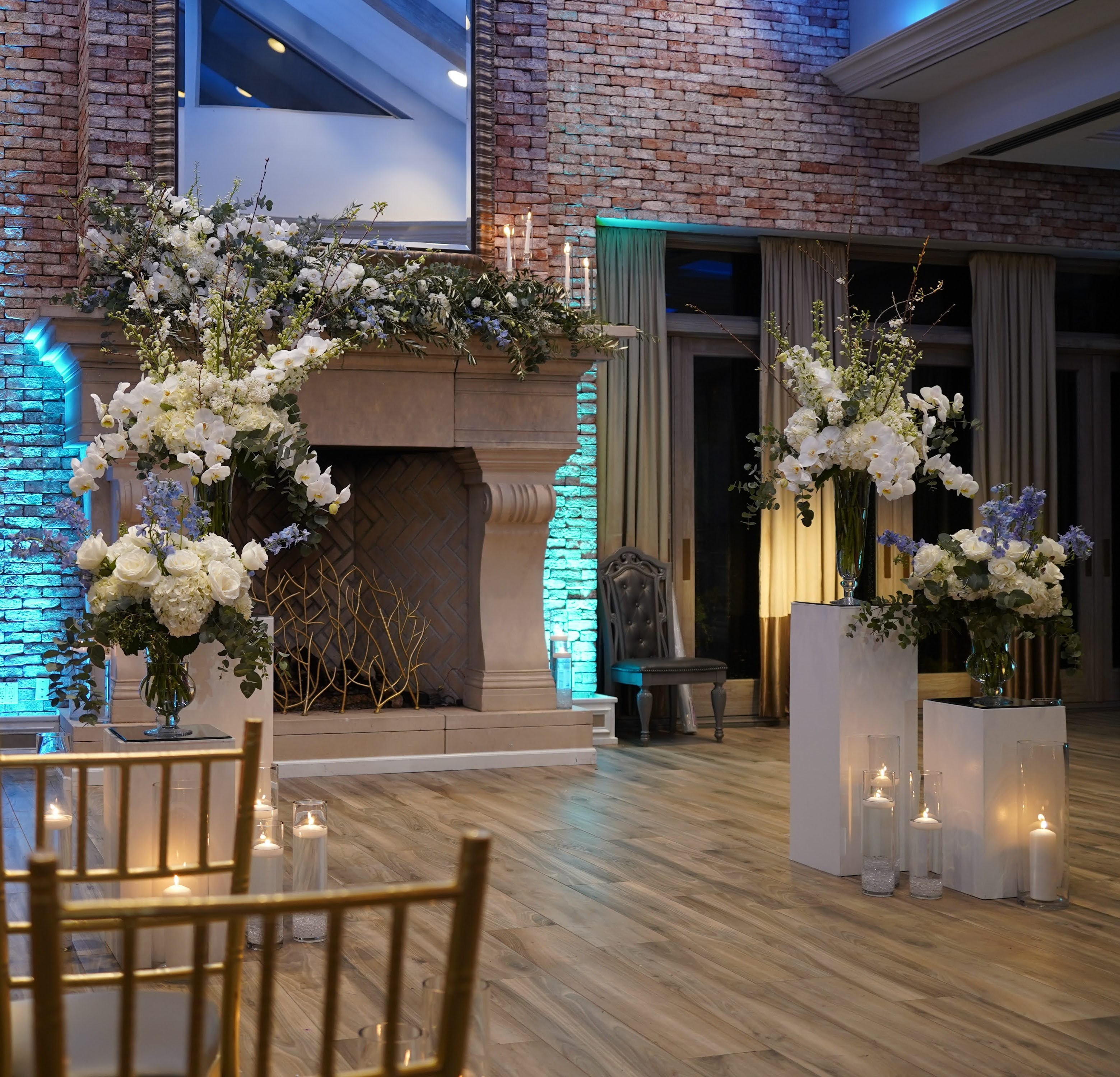 March wedding, The Somerley at The Fox Hollow, Woodbury, NY. White and blue color palette for ceremony flowers with orchids